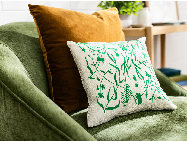 Woman's hand holding a smart phone with a personalized project template pulled up using Cricut's Design Space app